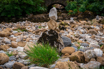 Cairn on the shore of the River Wharfe in Hubberholme, North Yorkshire, England, UK