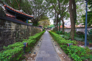Straight stone pathway in a chinese green park