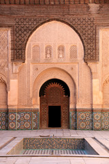 Fototapeta na wymiar Entrance to the colonnade around the inner courtyard of the Ben Youssef Madrasa (Qur'anic school) in Marrakesh, Morocco