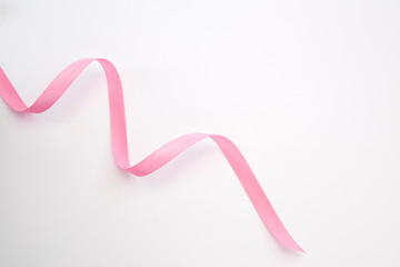 Fototapeta na wymiar Pink curly ribbon isolated on white