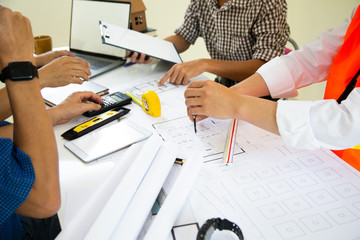 Engineers are meeting to discuss the design of a residential project.concept