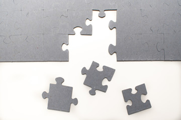A piece of a puzzle is missing, trying to solve it. Puzzle on background