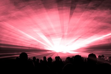 Fototapeta premium Red laser show nightlife club stage with party people crowd. Luxury entertainment with audience silhouettes in nightclub event, festival or New Years Eve. Beams and rays shining colorful lights
