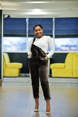 Charming african american woman posing at restaurant.