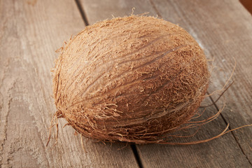 Coconut pieces pile on a wooden background