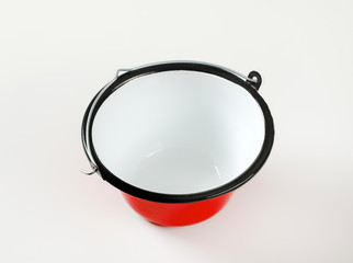 Red and white enamel cauldron / cooking pot with black rim and wire bail handle