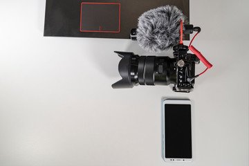 laptop camcorder blogger set on white table