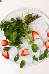 strawberries, mint leaves and ice
