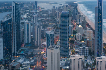 Fototapeta na wymiar Aerial cityscape with futuristic skyscrapers at dusk. Modern city skyline