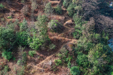 zig-zag hiking trail in the hills. Uphill hike in Nepal.