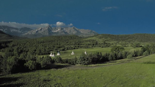 Double RL ranch gate of Ralph Lauren ranch leads to Indian Tepees, under San Juan Mountains