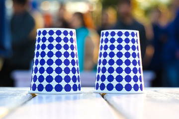 Close up plastic cups with blue circular design