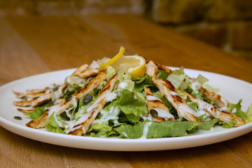 Grilled Chicken Breast fillet with fresh tomatoes vegetables salad. concept healthy food.