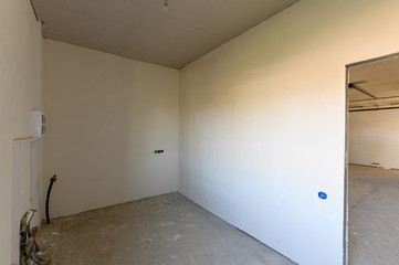 Russia, Moscow- September 10, 2019: interior room rough repair for self-finishing. interior decoration, bare walls of the room, stage of construction