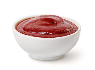 Tomato ketchup in a bowl isolated on white. - obrazy, fototapety, plakaty
