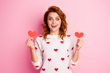 Close-up portrait of her she nice attractive lovely cheerful cheery glad positive wavy-haired girl holding in hands small little heart first date perfect match isolated on pink pastel color background