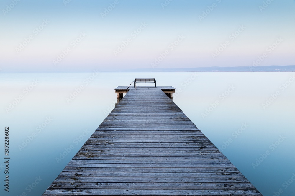 Canvas Prints wooden dock near the sea with the fog in the background