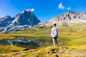 Young girl dancing in the mountains