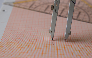 set square with compasses and scale paper