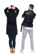 Back view of couple in winter jacket.