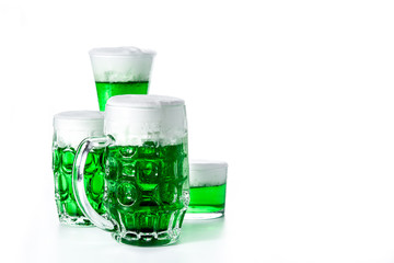 Traditional St Patrick's Day green beers isolated on white background. Copy space
