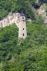 Fototapeta na wymiar Medieval watch tower on the bank of Argun River. Chechnya (Chechen Republic), Russia, Caucasus.