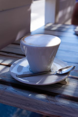 cup of cappuccino on the table