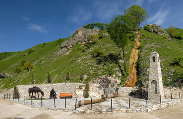 Waterfall Girl's Tears (Devich'i Slezy) and Monument to abrek ("brave man") Zelimkhan. Kharachoy village, Chechnya (Chechen Republic), Russia, Caucasus.