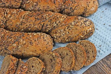  twisted crunzel bread with several types of seeds and whole grain flour