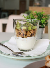 glass of yogurt with granola and fruit