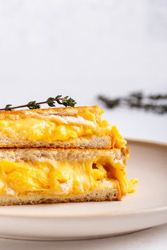 Scrambled egg sandwich with cheese, hearty breakfast