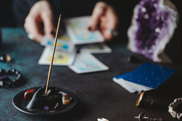 Witch predicts and reads the future through the use of Tarot cards.Mystical and occult concept.