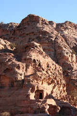 Tombs digged in red rock mountain of wonderful Petra. Jordan