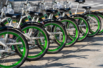 Naklejka na ściany i meble Public bicycle rental station in Seoul ,South Korea. Close up image of bicycle wheels.