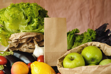Organic vegetables and eco bag in market.  Craft paper bag and products in organic food store.  Healthy nutrition, Zero Waste, Lifestyle Concept. Banner for for web, design. Mock up