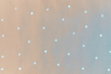 Gift wrapping paper texture. Painted paper, concept of small white dots, snowflakes.