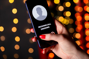 Phone call from unknown number. Scam, fraud or phishing with smartphone concept. Prank caller,...