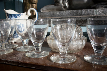 wide variety of plates bowls and mugs lined up for sale at the market.