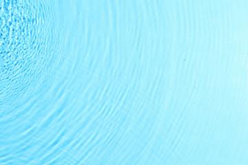 Fototapeta na wymiar texture of splashing clean water on blue background