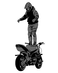 Young man on sports bike performs tricks. Isolated silhouette on a white background