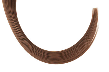Brown hair isolated on white background. Long ponytail