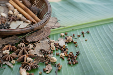 Spices and herbs on banana leaf. Food and cuisine ingredients.