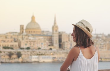 Young woman tourist portrait on vacation in Valletta Malta - obrazy, fototapety, plakaty