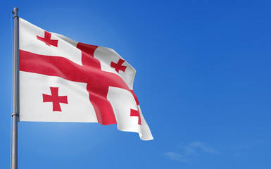 Georgia flag waving in the wind against deep blue sky. National theme, international concept. Copy space for text.