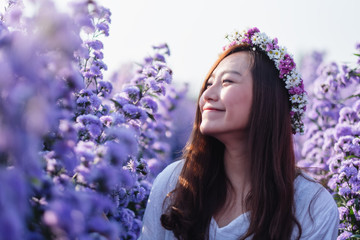 Portrait image of an asian woman in a beautiful Margaret flower field