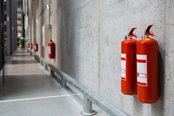 Fire extinguishers in the warehouse. Fire safety - obrazy, fototapety, plakaty