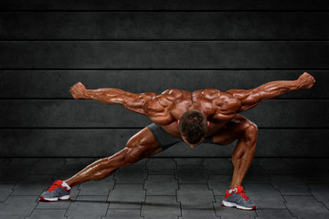 Bodybuilder Flexing Muscles. Studio Shot. Copy Space