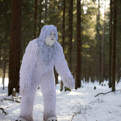 Yeti fairy tale character in winter forest.