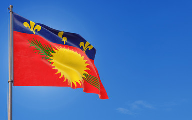 Guadeloupe flag waving in the wind against deep blue sky. National theme, international concept. Copy space for text.