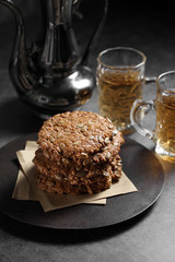 Chocolate and sunflower seed cookies with tea, Cookies and tea on rustic background